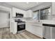 Clean kitchen featuring white cabinets, stainless steel appliances, and wood-style floors at 8500 Gull Dr, Las Vegas, NV 89134