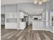 Open living space with bar, kitchen and white cabinets, offering modern feel at 8500 Gull Dr, Las Vegas, NV 89134