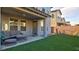 Inviting covered patio with comfortable seating and a manicured artificial turf lawn for easy outdoor enjoyment at 8532 Caddy Corner St, Las Vegas, NV 89139