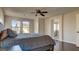 Bright bedroom features a large bed, dark wood floors, and an ensuite bathroom at 8532 Caddy Corner St, Las Vegas, NV 89139