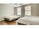 Bright bedroom featuring hardwood floors, two beds, a dresser, and lots of natural light at 8532 Caddy Corner St, Las Vegas, NV 89139