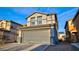 Inviting two-story home featuring an attached two-car garage, stucco siding, and a beautifully tiled roof at 8532 Caddy Corner St, Las Vegas, NV 89139