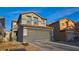 Well-maintained two-story home with a large two-car garage, neutral-toned stucco, and a tile roof at 8532 Caddy Corner St, Las Vegas, NV 89139