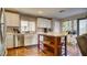 Functional kitchen with stainless steel appliances, white cabinetry, and an island at 8532 Caddy Corner St, Las Vegas, NV 89139