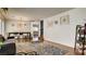 Open-concept living space with modern decor, a dining area, and access to stairs at 8532 Caddy Corner St, Las Vegas, NV 89139