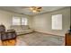 Bright living room with plush seating, a ceiling fan, and natural light from windows at 8532 Caddy Corner St, Las Vegas, NV 89139