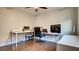 Functional office space featuring hardwood floors, natural light, and multiple desks with monitors at 8532 Caddy Corner St, Las Vegas, NV 89139