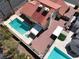 Aerial image of a house with a red tile roof, pool, and desert landscaping at 8600 Soneto Ln, Las Vegas, NV 89117