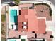 Overhead view of home and pool with tile roof and desert landscaping at 8600 Soneto Ln, Las Vegas, NV 89117