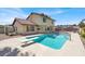 Backyard swimming pool with diving board on a sunny day at 8600 Soneto Ln, Las Vegas, NV 89117