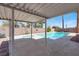 Backyard features a covered patio, pool, and spa at 8600 Soneto Ln, Las Vegas, NV 89117