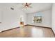 Bedroom with wood look floors, ceiling fan and an ensuite bathroom at 8600 Soneto Ln, Las Vegas, NV 89117