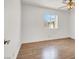 Bright bedroom featuring hardwood floors, ceiling fan, and a window with natural light at 8600 Soneto Ln, Las Vegas, NV 89117