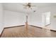Bedroom features wood look floors and a ceiling fan at 8600 Soneto Ln, Las Vegas, NV 89117