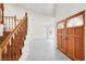 Inviting entryway featuring a staircase and large double doors for a grand welcome at 8600 Soneto Ln, Las Vegas, NV 89117