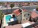 Aerial view of a home with a pool, spa, and a large backyard at 8600 Soneto Ln, Las Vegas, NV 89117