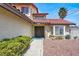 Close up view of the front entrance with a well-manicured yard and stone walkway at 8600 Soneto Ln, Las Vegas, NV 89117