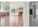 The kitchen has tile floors, wooden cabinets, stainless steel appliances, and a view of the backyard at 8600 Soneto Ln, Las Vegas, NV 89117