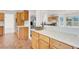 Updated kitchen featuring quartz countertops, wooden cabinets, stainless steel appliances, and tile floors at 8600 Soneto Ln, Las Vegas, NV 89117