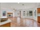 Spacious living room with brick fireplace, tile flooring, large windows, and access to the backyard at 8600 Soneto Ln, Las Vegas, NV 89117