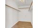 Walk-in Closet features wood look floors and built-in shelving at 8600 Soneto Ln, Las Vegas, NV 89117