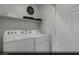 Bright laundry room featuring modern, white, front-loading washer and dryer at 890 Apatite Pl # Lot 68, Henderson, NV 89011