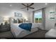 Serene main bedroom featuring a plush bed, stylish decor, and a large window offering natural light at 890 Apatite Pl # Lot 68, Henderson, NV 89011
