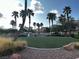 Enjoy the outdoors in the common area with green space and beautiful palm trees at 9078 Camp Light Ave # 102, Las Vegas, NV 89149