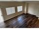 Bright living room features hard wood floors, natural light, and a neutral color palette at 9078 Camp Light Ave # 102, Las Vegas, NV 89149