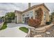Charming stucco home featuring a private backyard with a patio and unique rock garden at 916 Pro Players Dr, Las Vegas, NV 89134