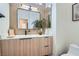 Bathroom vanity featuring a modern mirror, wood cabinet, and sleek fixtures at 916 Pro Players Dr, Las Vegas, NV 89134