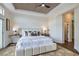 Inviting bedroom featuring a decorative ceiling, plush bed, and stylish bedside tables at 916 Pro Players Dr, Las Vegas, NV 89134