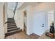 Entryway features stairs with carpet, wood floor, and white doors at 916 Pro Players Dr, Las Vegas, NV 89134