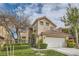 Charming two-story home featuring a well-manicured lawn and a two-car garage at 916 Pro Players Dr, Las Vegas, NV 89134