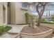 Inviting front entrance with unique landscaping and a well-manicured lawn and rock garden at 916 Pro Players Dr, Las Vegas, NV 89134