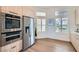 Bright kitchen showcasing stainless steel appliances, modern wood cabinets, and plenty of natural light at 916 Pro Players Dr, Las Vegas, NV 89134