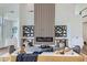 Cozy living room featuring modern decor, a linear fireplace, and comfortable seating at 916 Pro Players Dr, Las Vegas, NV 89134