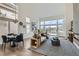 Open-concept living space featuring high ceilings, neutral tones, and stylish furnishings at 916 Pro Players Dr, Las Vegas, NV 89134