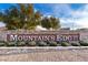 Mountain's Edge community sign, showcasing lush landscaping and a welcoming entrance at 9277 Valley Ranch Ave, Las Vegas, NV 89178