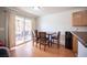 Cozy dining area featuring backyard patio access, wood floors, and comfortable seating, perfect for Gathering meals at 9277 Valley Ranch Ave, Las Vegas, NV 89178