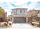 Charming two-story home featuring a well-manicured front yard and an attached two-car garage at 9277 Valley Ranch Ave, Las Vegas, NV 89178
