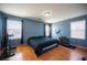 Comfortable main bedroom with hardwood floors and ample natural light, creating a serene and inviting atmosphere at 9277 Valley Ranch Ave, Las Vegas, NV 89178