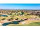 Beautiful aerial view of the golf course with mature trees, water features and desert landscaping at 9305 Quail Ridge Dr, Las Vegas, NV 89134