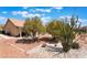 Beautiful backyard with desert landscaping and a covered patio area at 9305 Quail Ridge Dr, Las Vegas, NV 89134
