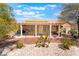 Well-maintained backyard featuring a covered patio and easy-care desert landscaping at 9305 Quail Ridge Dr, Las Vegas, NV 89134