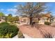 Desert landscaped backyard with covered patio is perfect for enjoying the outdoors at 9305 Quail Ridge Dr, Las Vegas, NV 89134