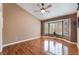 A bright bedroom features a bay window, ceiling fan, and hardwood flooring at 9305 Quail Ridge Dr, Las Vegas, NV 89134