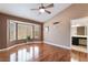 A cozy bedroom featuring a bay window, hardwood floor, and ensuite bath at 9305 Quail Ridge Dr, Las Vegas, NV 89134