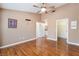 This bedroom features a ceiling fan, multiple doorways, and hardwood flooring at 9305 Quail Ridge Dr, Las Vegas, NV 89134