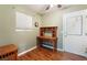 Cozy room features a wood desk, hard wood floors, and natural lighting at 9305 Quail Ridge Dr, Las Vegas, NV 89134